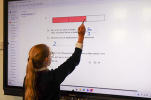 Student using a smartboard