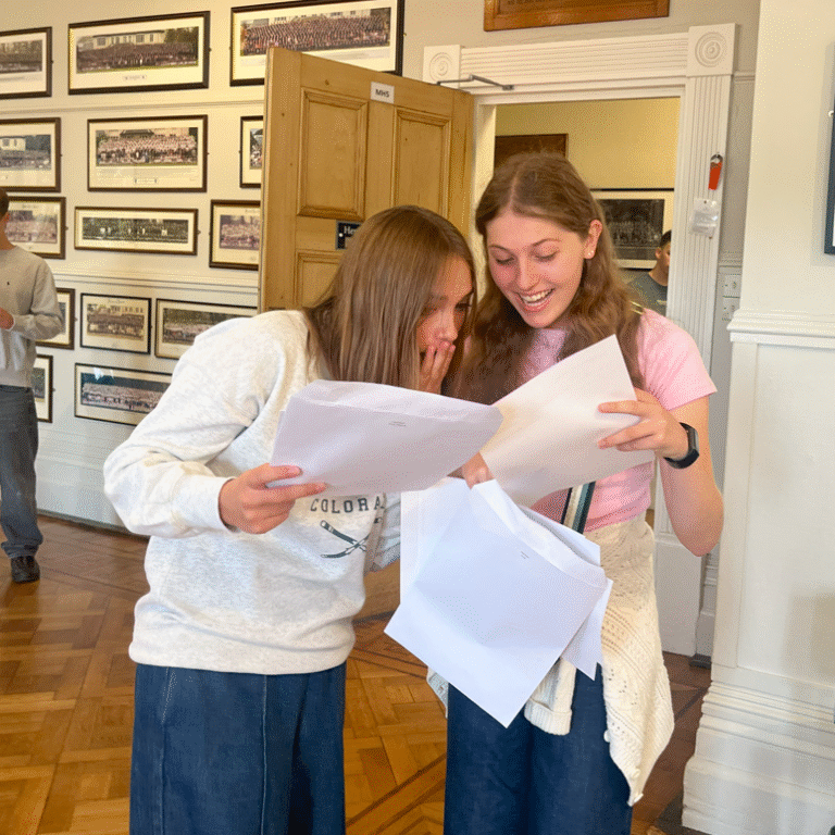 students looking through their GCSE results