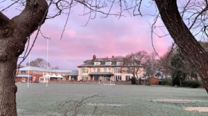 A morning in Ballard School with pink skies and clouds forming